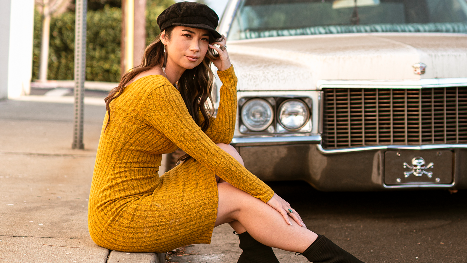 Vanessa Rene sitting in front of car