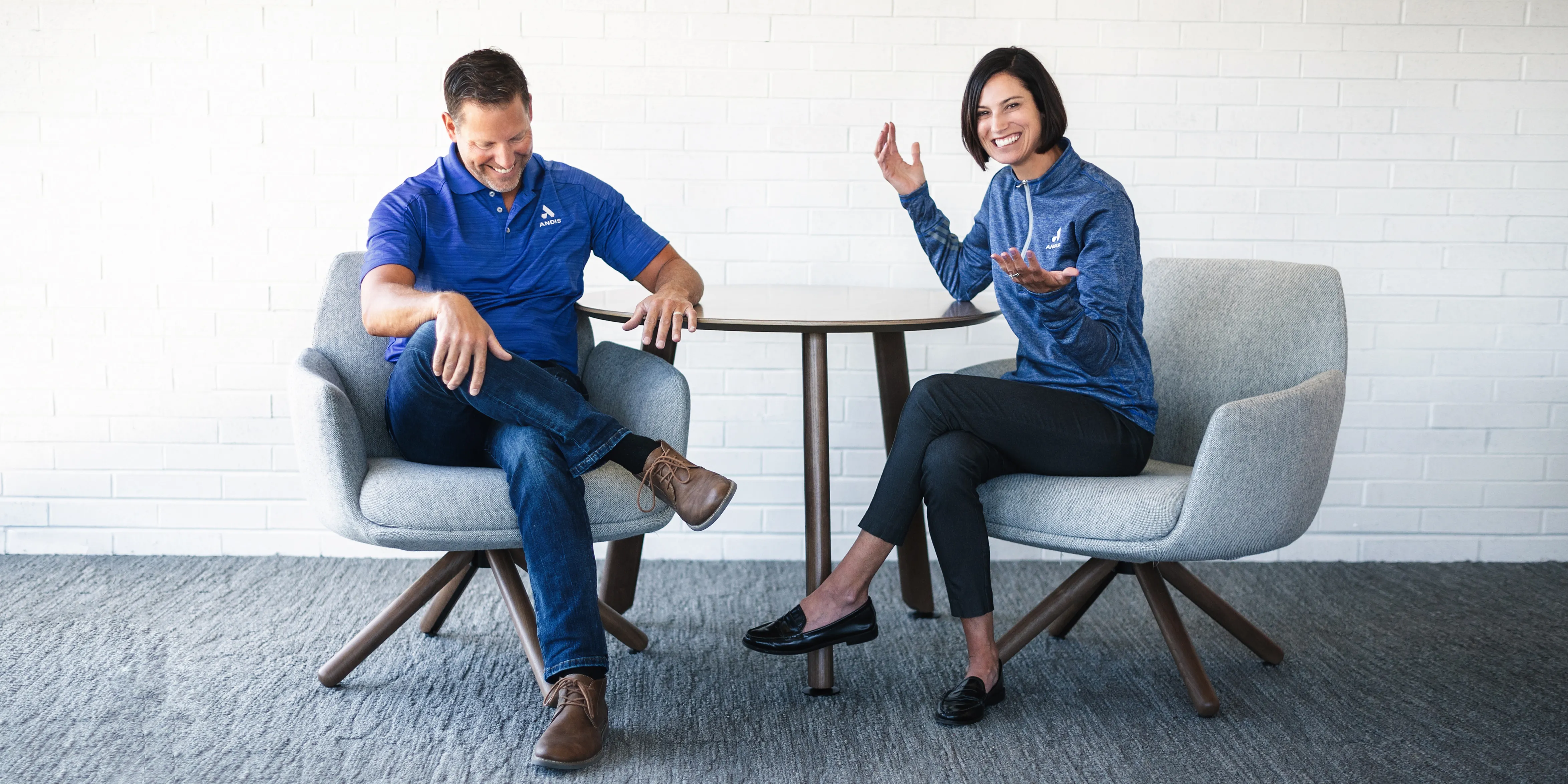 large image of Matt and Laura Andis sitting at a table